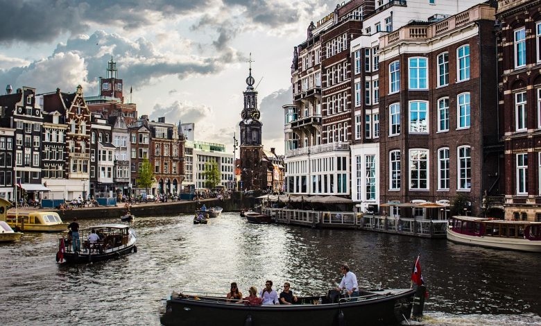 city canal amsterdam tourists 4388160