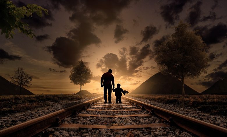 father and son walking railway 2258681